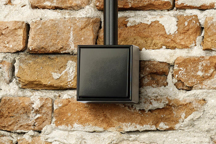 Schalter auf Backsteinwand